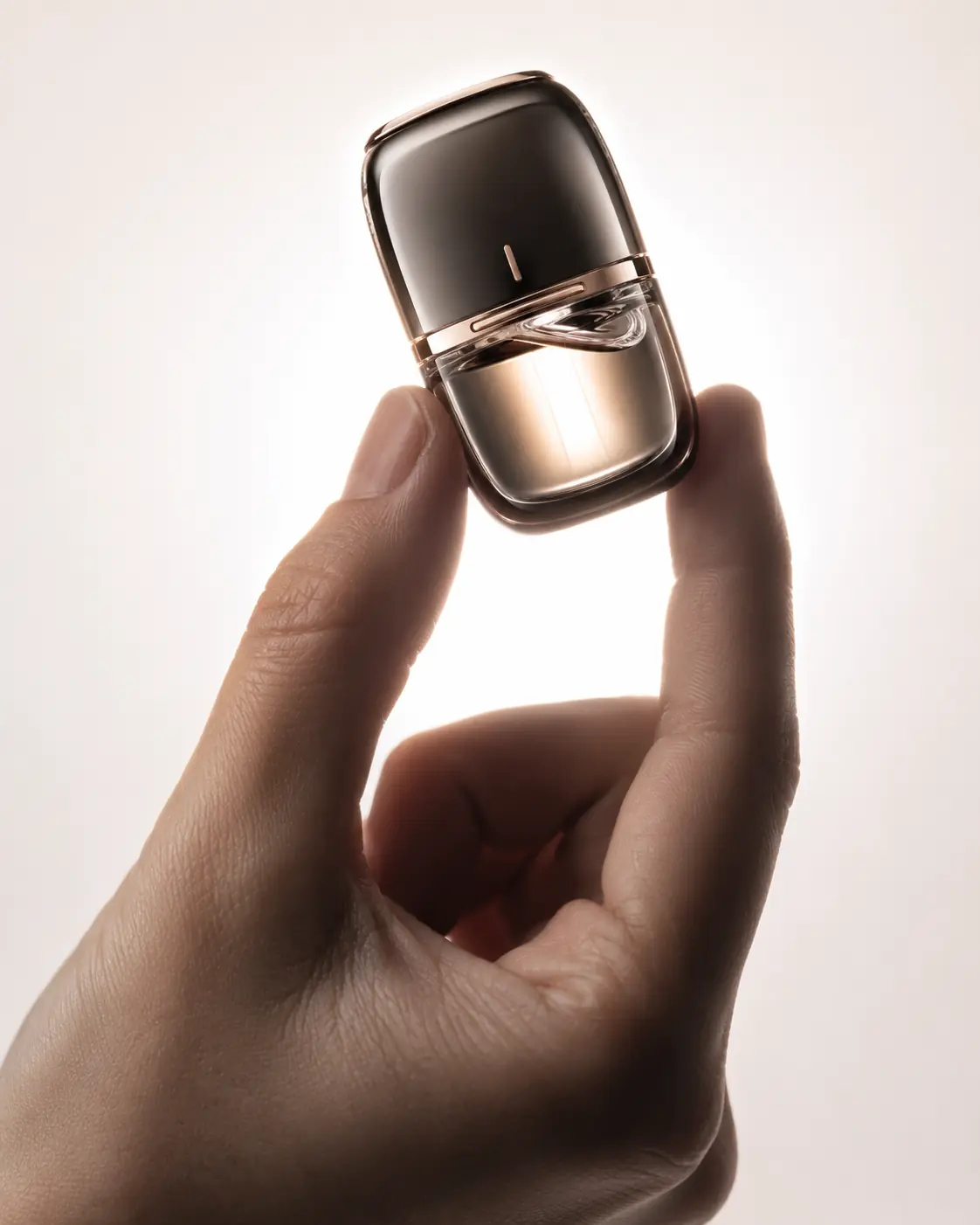 Transparent wireless earbuds and charging case lit by warm golden light