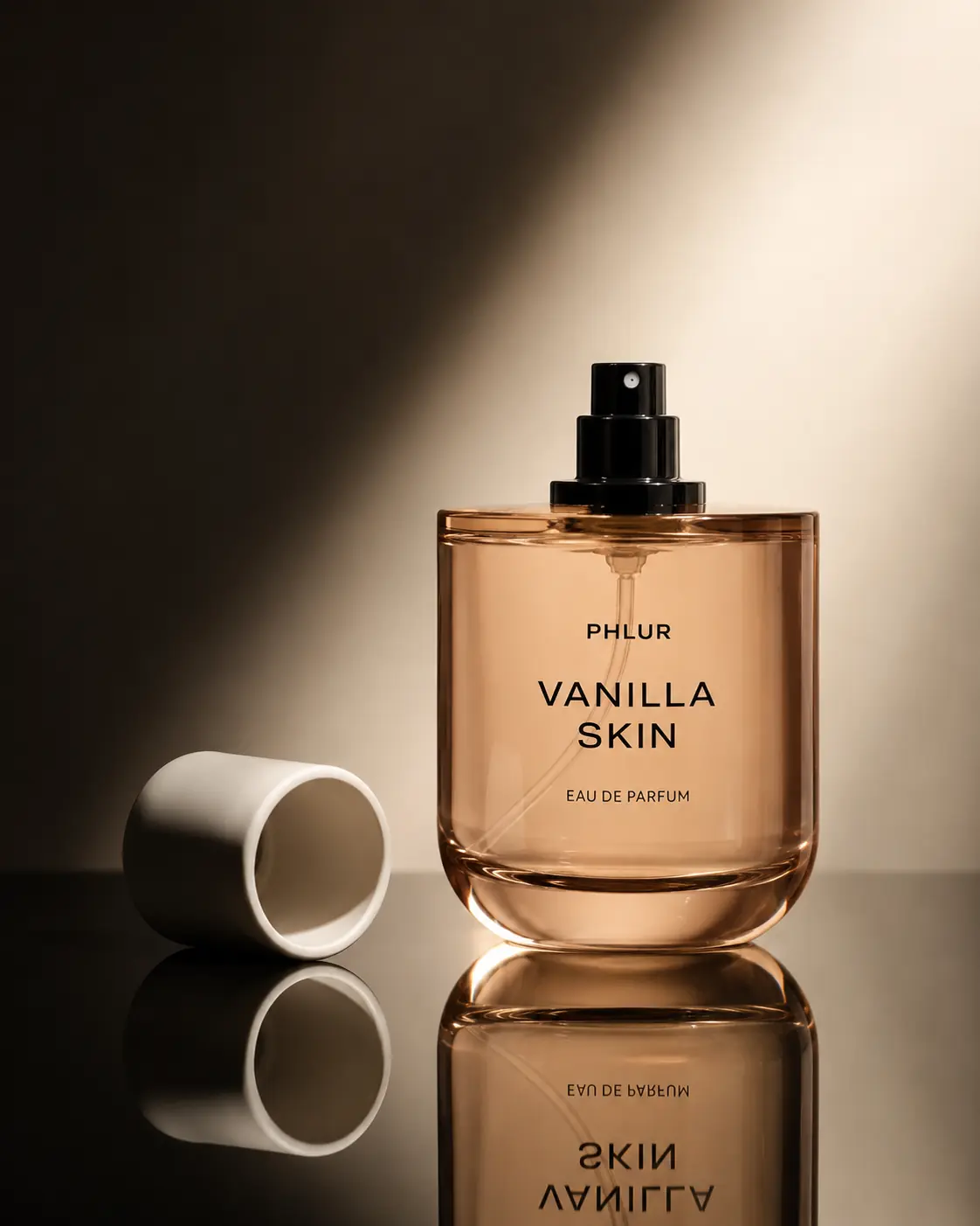 Fragrance bottle styled in a warm reflective still-life setting