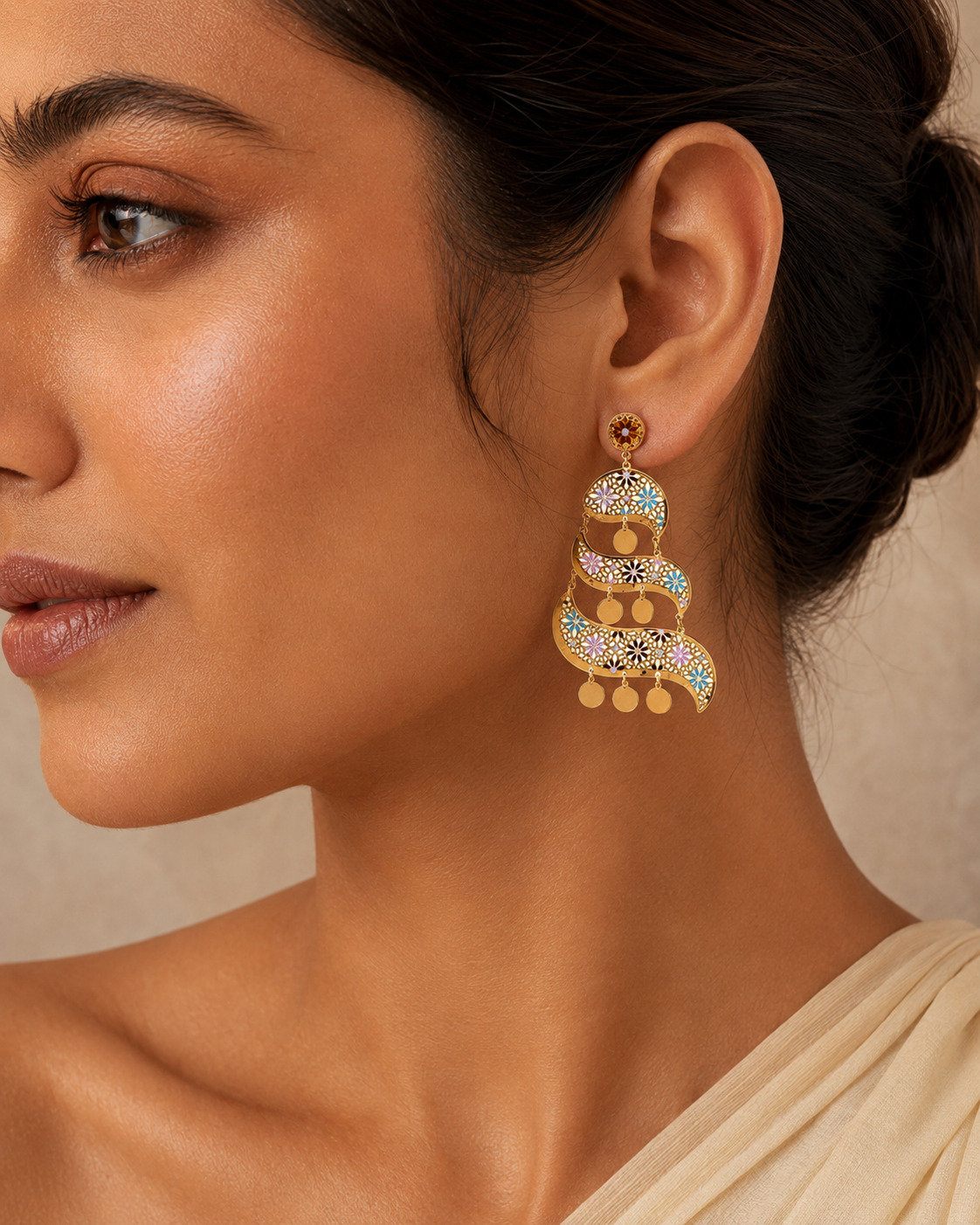 Ornate gold filigree statement earring in a warm editorial beauty portrait