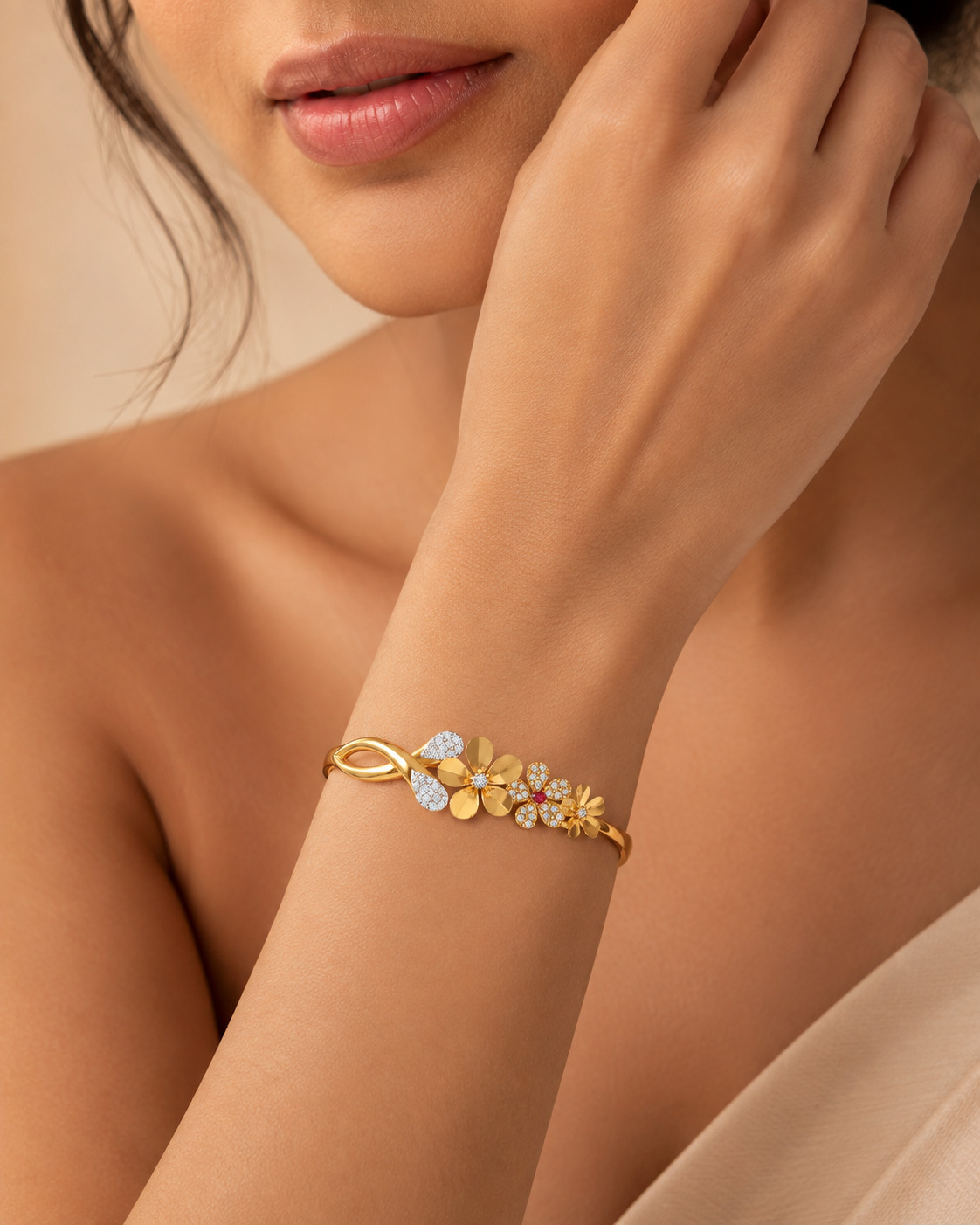 Floral gold and diamond bracelet presented in a close wrist portrait